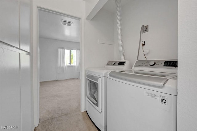 1101 Willow Tree Dr Unit D, Las Vegas, NV 89128 - laundry room with independent washer and dryer and light carpet