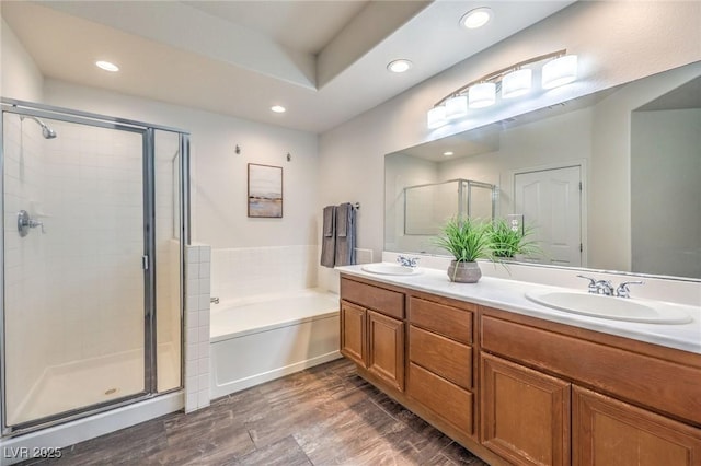 979 Coatbridge St, Las Vegas, NV 89145 - full bathroom with a stall shower, a bath, double vanity, recessed lighting, and wood finished floors
