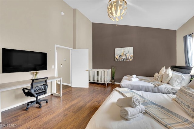 3659 Gerri Bay Ln, Las Vegas, NV 89147 - bedroom featuring high vaulted ceiling, wood finished floors, baseboards, an office area, and a chandelier