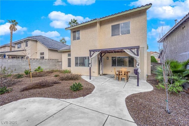 3659 Gerri Bay Ln, Las Vegas, NV 89147 - back of house featuring stucco siding, a fenced backyard, and a patio area