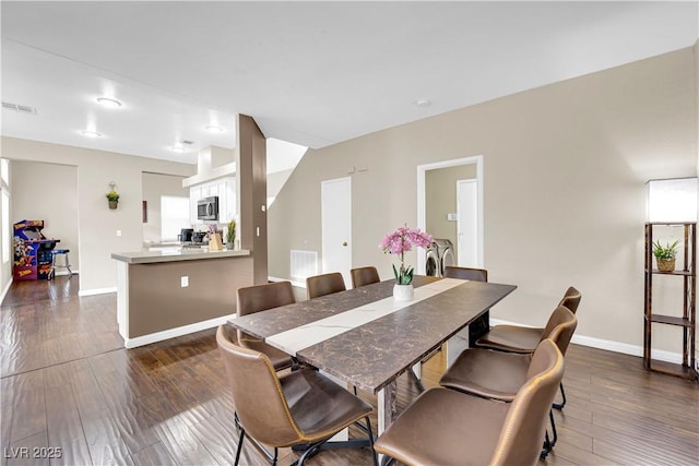 3659 Gerri Bay Ln, Las Vegas, NV 89147 - dining space featuring dark wood-style floors and baseboards
