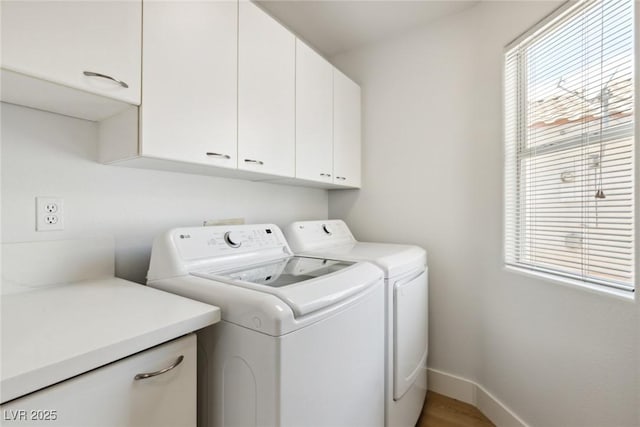 8312 Raphael Ct, Las Vegas, NV 89129 - laundry area featuring cabinet space, washer and dryer, and baseboards