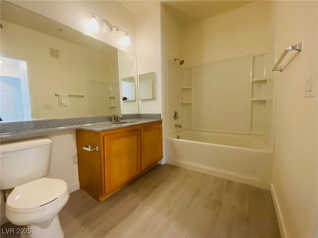 10290 Gilmore Canyon Ct Unit 103, Las Vegas, NV 89129 - bathroom with wood finished floors, toilet, vanity, and shower / bathtub combination