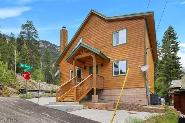 4830 Silver Tip Way, Mount Charleston, NV 89124 - chalet / cabin with a chimney, central air condition unit, and a mountain view
