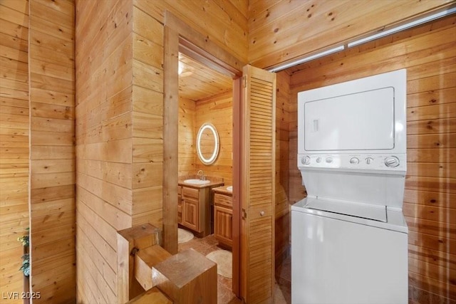 4830 Silver Tip Way, Mount Charleston, NV 89124 - laundry room featuring estacked washer and dryer and wood walls