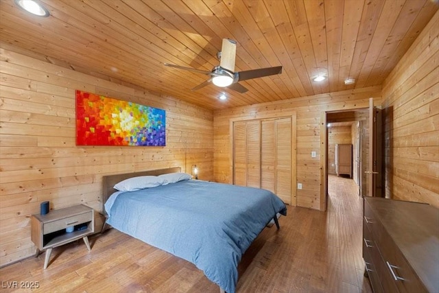 4830 Silver Tip Way, Mount Charleston, NV 89124 - bedroom featuring wood ceiling, wood walls, recessed lighting, wood finished floors, and a closet