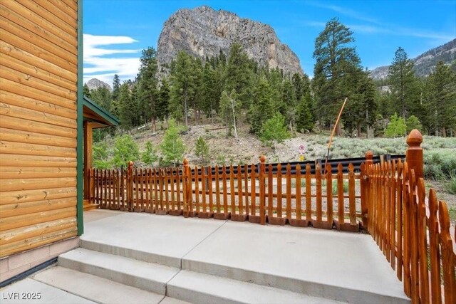 4830 Silver Tip Way, Mount Charleston, NV 89124 - view of patio / terrace with a mountain view and a forest view