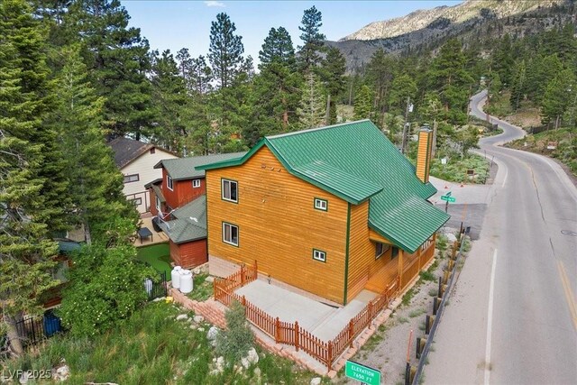 4830 Silver Tip Way, Mount Charleston, NV 89124 - view of subject property featuring a mountain backdrop and a forest