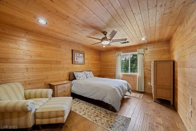 4830 Silver Tip Way, Mount Charleston, NV 89124 - bedroom with wood ceiling, wooden walls, hardwood / wood-style flooring, recessed lighting, and a ceiling fan