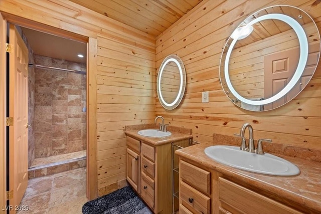 4830 Silver Tip Way, Mount Charleston, NV 89124 - full bathroom featuring two vanities, a shower stall, wooden ceiling, wooden walls, and stone finish flooring