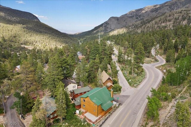 4830 Silver Tip Way, Mount Charleston, NV 89124 - aerial overview of property's location with a mountain backdrop and a heavily wooded area