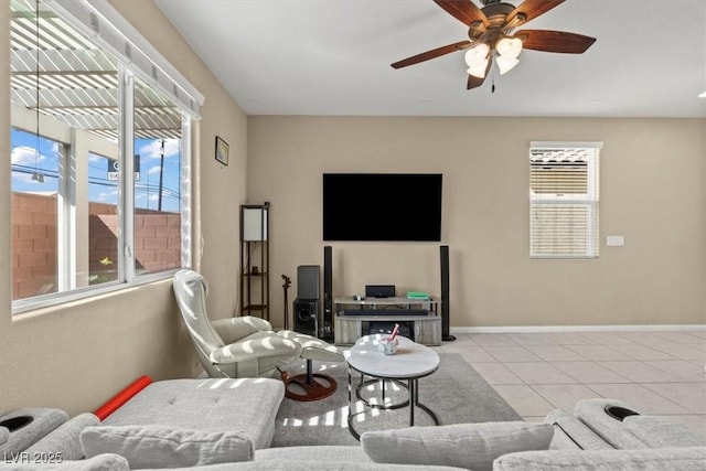 5667 Foxglove Field St, Las Vegas, NV 89130 - living room with plenty of natural light, ceiling fan, tile patterned floors, and baseboards