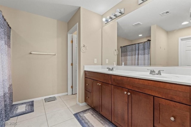 5667 Foxglove Field St, Las Vegas, NV 89130 - full bath featuring double vanity, baseboards, tile patterned flooring, and a shower with shower curtain