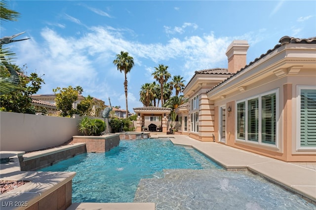 277 Dark Forest Ave, Las Vegas, NV 89123 - view of swimming pool featuring a patio, a fenced backyard, and a pool with connected hot tub