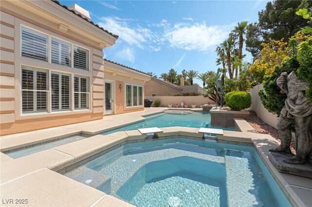 277 Dark Forest Ave, Las Vegas, NV 89123 - view of pool featuring a pool with connected hot tub and a fenced backyard