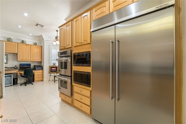 277 Dark Forest Ave, Las Vegas, NV 89123 - kitchen with built in appliances, light brown cabinetry, a ceiling fan, crown molding, and light tile patterned floors