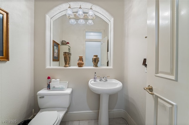 277 Dark Forest Ave, Las Vegas, NV 89123 - bathroom with toilet, baseboards, and tile patterned flooring