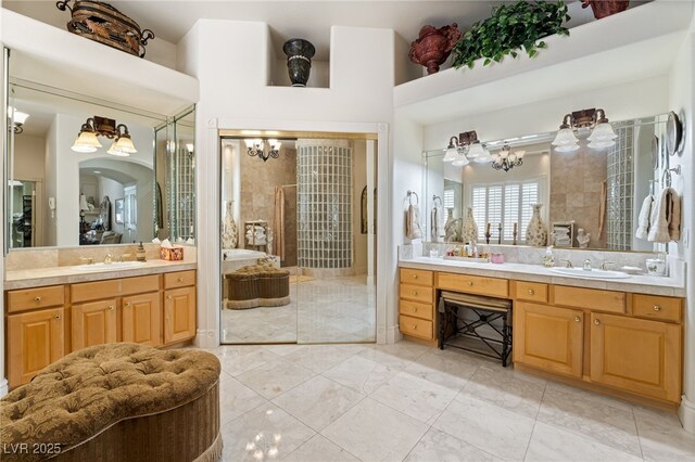 277 Dark Forest Ave, Las Vegas, NV 89123 - bathroom featuring a shower stall, vanity, a chandelier, and a bath