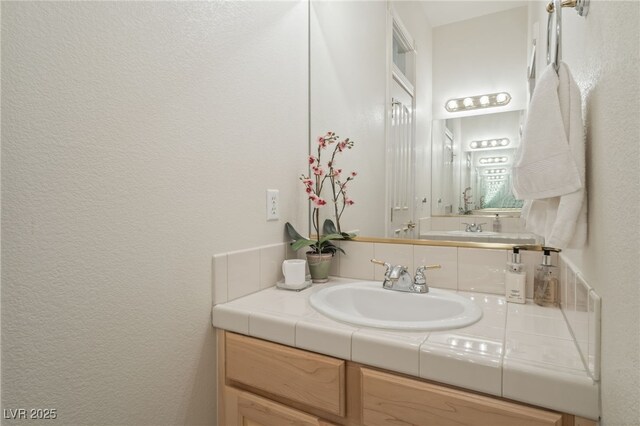 277 Dark Forest Ave, Las Vegas, NV 89123 - bathroom with vanity and a textured wall