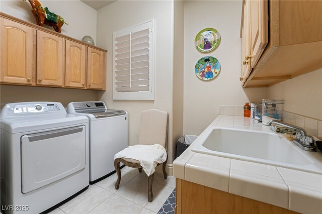 277 Dark Forest Ave, Las Vegas, NV 89123 - washroom with washing machine and dryer, cabinet space, and light tile patterned floors