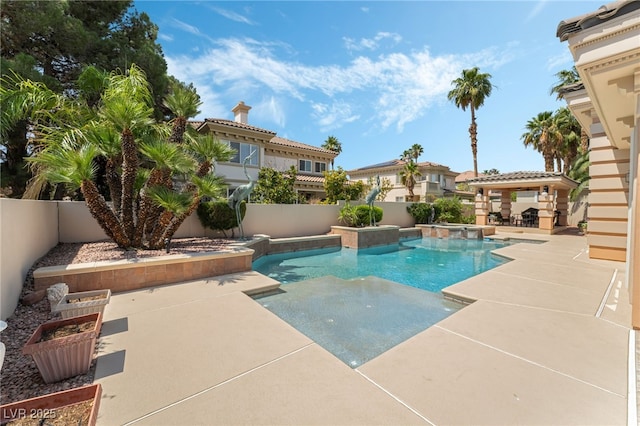 277 Dark Forest Ave, Las Vegas, NV 89123 - view of pool with a pool with connected hot tub, a patio, and a fenced backyard