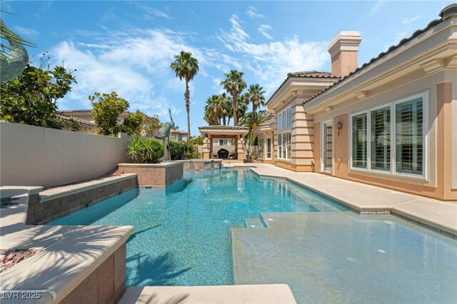 277 Dark Forest Ave, Las Vegas, NV 89123 - view of swimming pool with a patio area and a pool with connected hot tub