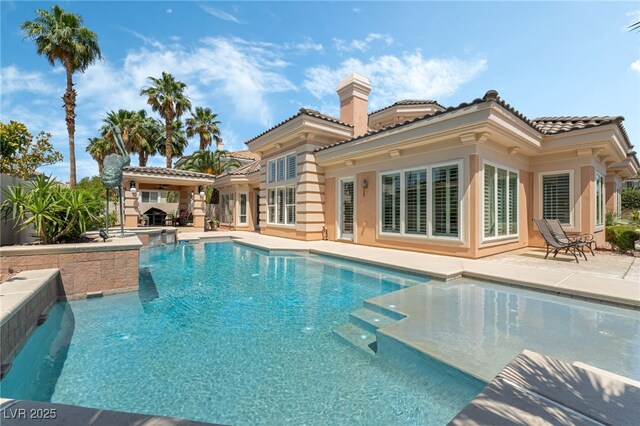277 Dark Forest Ave, Las Vegas, NV 89123 - view of pool featuring a patio area and a pool with connected hot tub