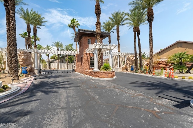 277 Dark Forest Ave, Las Vegas, NV 89123 - view of asphalt street featuring curbs and a gated entry