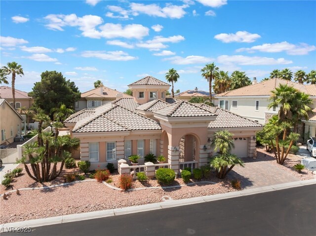277 Dark Forest Ave, Las Vegas, NV 89123 - mediterranean / spanish house with a tiled roof, a garage, stucco siding, driveway, and a residential view