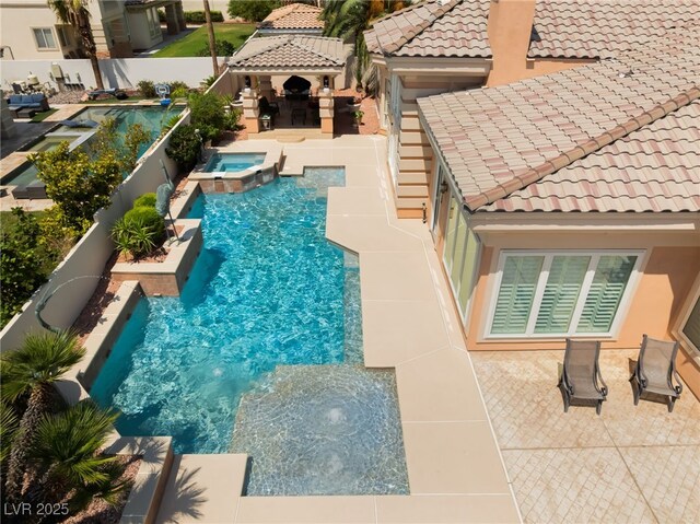 277 Dark Forest Ave, Las Vegas, NV 89123 - view of swimming pool featuring a gazebo, a pool with connected hot tub, a fenced backyard, and a patio