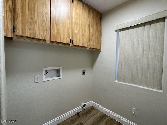 3161 Quail Song Dr Unit 3161, Laughlin, NV 89029 - laundry room with cabinet space, washer hookup, dark wood finished floors, electric dryer hookup, and baseboards