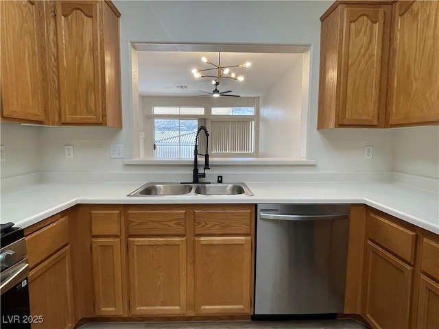 3161 Quail Song Dr Unit 3161, Laughlin, NV 89029 - kitchen featuring stainless steel appliances, a sink, a chandelier, light countertops, and brown cabinets