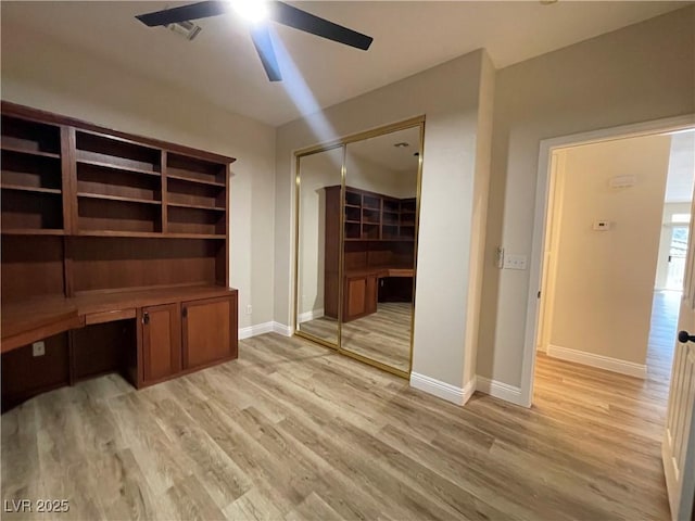 3161 Quail Song Dr Unit 3161, Laughlin, NV 89029 - unfurnished office with a ceiling fan, light wood-style flooring, baseboards, and built in study area