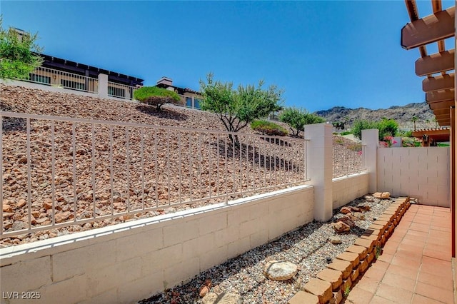 445 Intrepid Ct, Boulder City, NV 89005 - fenced yard with a mountain view