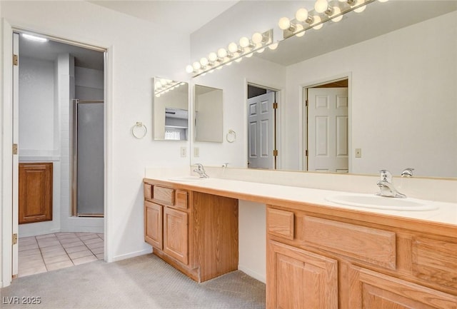 445 Intrepid Ct, Boulder City, NV 89005 - bathroom featuring double vanity, a shower with door, and tile patterned flooring