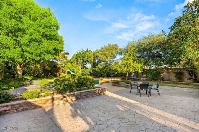 2001 Silver Ave, Las Vegas, NV 89102 - view of patio with outdoor dining area and view of scattered trees