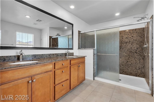 2832 Aragon Terrace Way, Henderson, NV 89044 - full bathroom with tile patterned flooring, a shower stall, double vanity, and recessed lighting