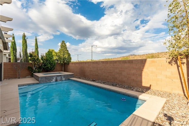 2832 Aragon Terrace Way, Henderson, NV 89044 - view of swimming pool with a fenced backyard and a pool with connected hot tub