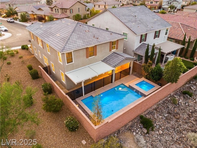2832 Aragon Terrace Way, Henderson, NV 89044 - view of pool with a residential view, a pool with connected hot tub, and a fenced backyard