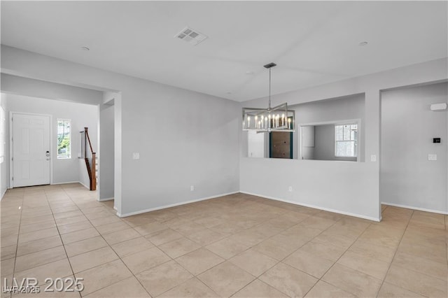 2832 Aragon Terrace Way, Henderson, NV 89044 - empty room featuring a chandelier, tile patterned flooring, and baseboards