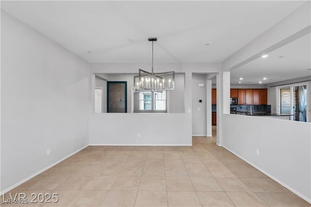 2832 Aragon Terrace Way, Henderson, NV 89044 - unfurnished dining area with a chandelier, recessed lighting, baseboards, and light tile patterned floors