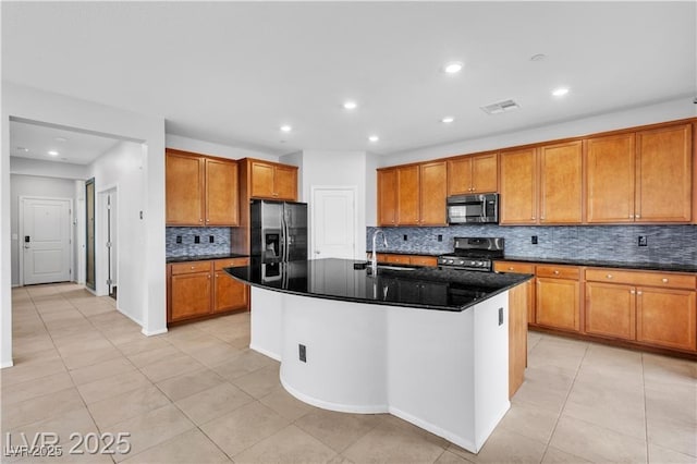 2832 Aragon Terrace Way, Henderson, NV 89044 - kitchen featuring stainless steel appliances, a sink, brown cabinetry, light tile patterned flooring, and decorative backsplash