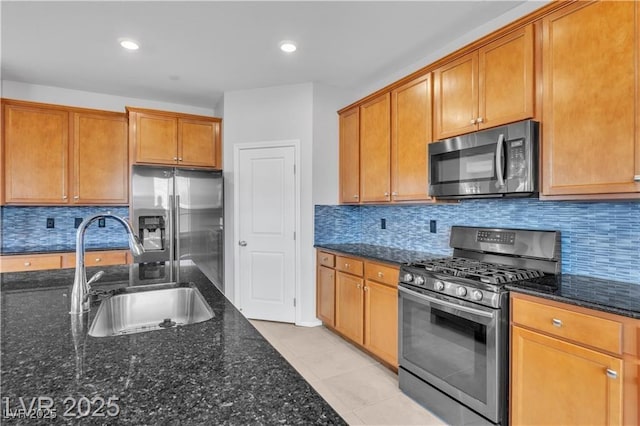 2832 Aragon Terrace Way, Henderson, NV 89044 - kitchen with appliances with stainless steel finishes, a sink, dark stone countertops, backsplash, and recessed lighting