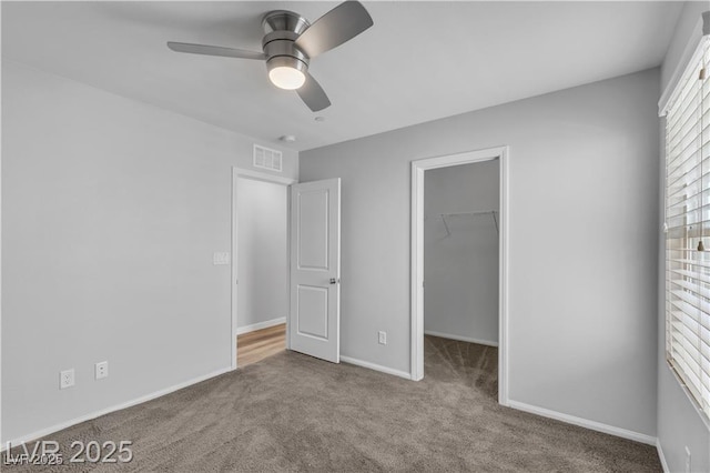 2832 Aragon Terrace Way, Henderson, NV 89044 - unfurnished bedroom with a spacious closet, carpet flooring, baseboards, a closet, and ceiling fan