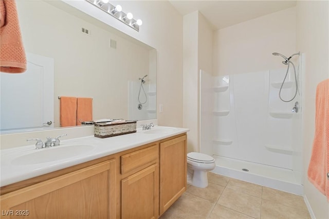 8985 S Durango Dr Unit 1177, Las Vegas, NV 89113 - full bathroom featuring a shower, tile patterned floors, toilet, and double vanity
