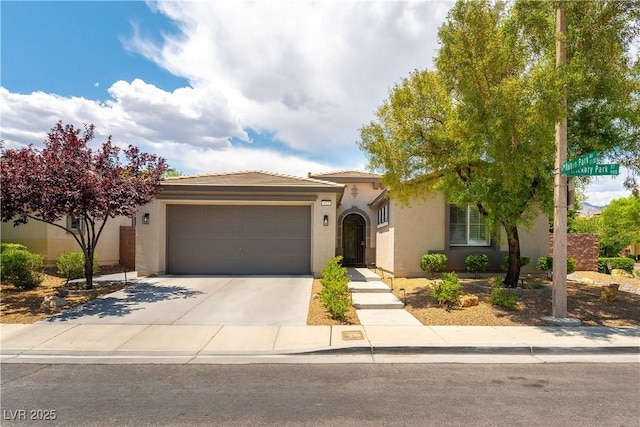 913 Hickory Park St, Las Vegas, NV 89138 - view of front of house with stucco siding, driveway, and an attached garage