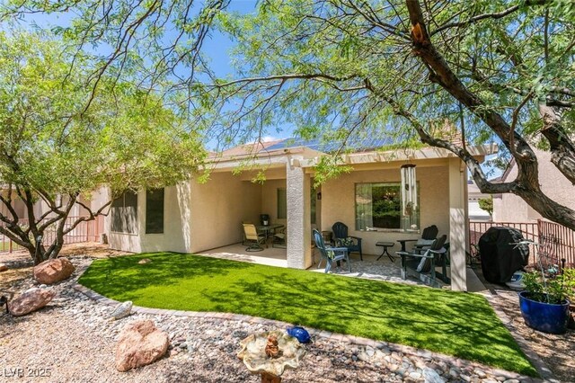 2111 Tiger Links Dr, Henderson, NV 89012 - rear view of property with stucco siding and a patio area