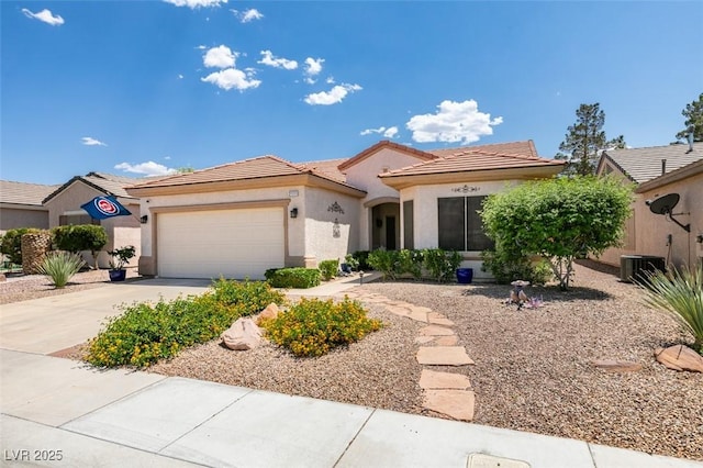 2111 Tiger Links Dr, Henderson, NV 89012 - view of front of home with an attached garage, central AC, concrete driveway, and stucco siding
