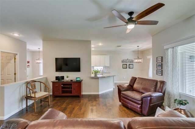 2111 Tiger Links Dr, Henderson, NV 89012 - living area with dark wood-style floors, a ceiling fan, baseboards, and recessed lighting