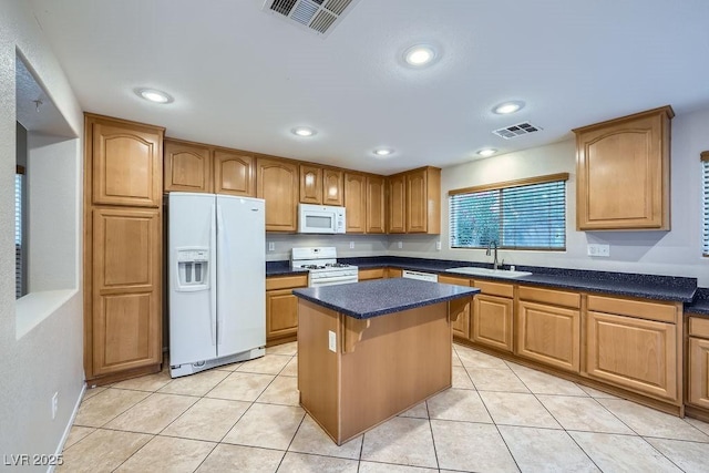 765 Jewel Tower St, Las Vegas, NV 89178 - kitchen with white appliances, a sink, a center island, light tile patterned flooring, and a breakfast bar
